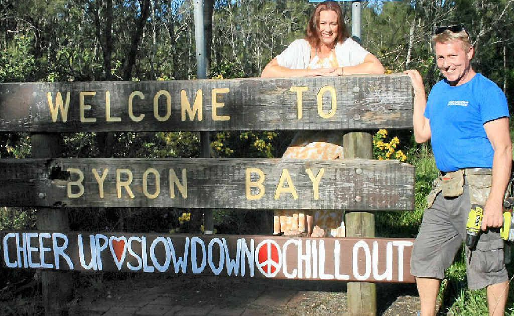 CHILL OUT: The sign is back so we can all relax – Jodie Molloy and Ben Ormonde show off their handiwork on Ewingsdale Rd, Byron Bay. CHILL OUT: The sign is back so we can all relax – Jodie Molloy and Ben Ormonde show off their handiwork on Ewingsdale Rd, Byron Bay.